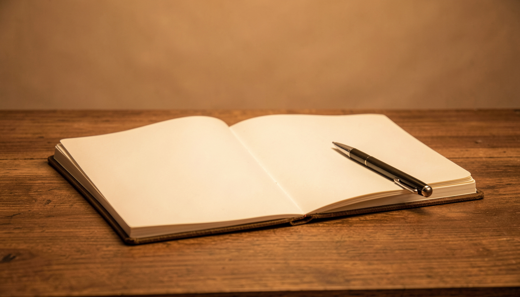 Warm sepia studio photograph of an open blank notebook and pen resting on a wooden desk, soft amber light, calm and inviting mood